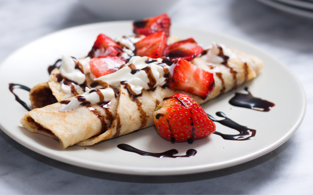 Crepe with strawberries and chocolate sauce